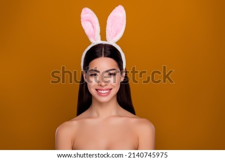 Photo of charming flawless skin asian girl bunny ears easter concept bare skinny shoulders isolated pastel background