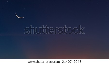 Crescent moon on dusk sky Twilight after sundown free space for text, Religion off Islamic on ramadan month, Eid Al Adha, Eid Al Fitr, Muharram  Royalty-Free Stock Photo #2140747043