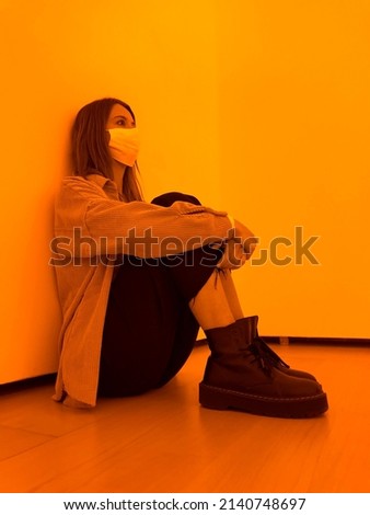 a girls sitting in a modern room