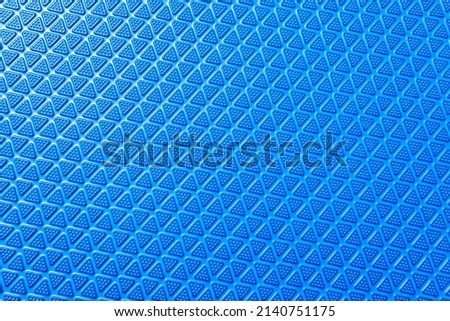 Texture of blue non-slip rubber mat, may be used as background Royalty-Free Stock Photo #2140751175