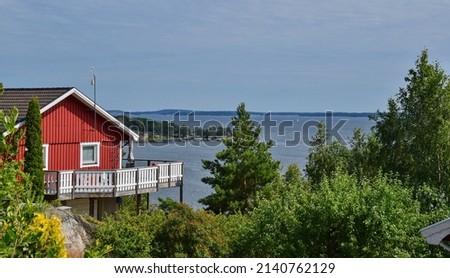 A typical red wooden house in Sweden, Dalarö, archipelago, above sea, romantic view, boats, life style, swedes, living, architecture, scandic, scandinavia, village, town, cityscape, cottage, weekend
 Royalty-Free Stock Photo #2140762129