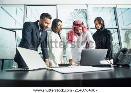Multiethnic corporate business team meeting in the office for a strategic marketing plan - Office workers, entrepreneurs and company employee at work in a multinational company Royalty-Free Stock Photo #2140764087