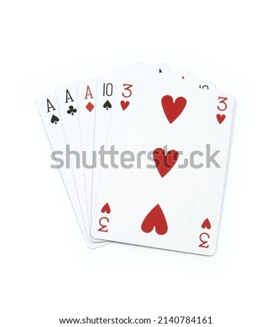 Three of a kind - poker cards on white background