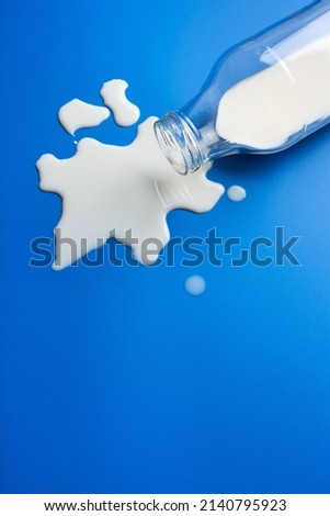 lactose intolerance allergy. milk bottle splatter. avoid dangerous dairy Royalty-Free Stock Photo #2140795923