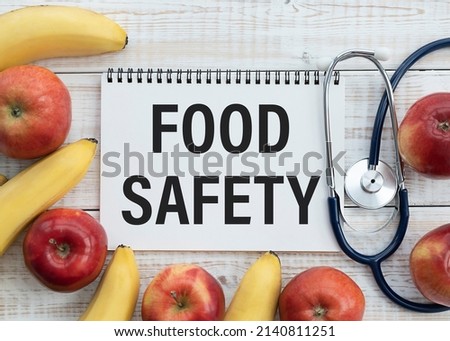 Notepad With Food Safety Text Over Surrounded With Organic Fresh Vegetables.