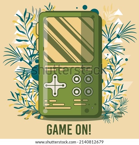 Retro portable game on leaf background, Multimedia or video game computer handheld portable retro game console.