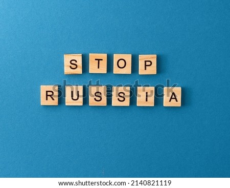 Stop Russia background. Phrase from wooden letters. Top view words. The phrases is laid out in wood letter. Motivation.