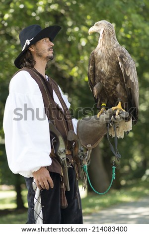 falconer holding Sea Eagle on glove