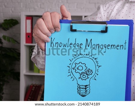 Knowledge management is shown on a photo using the text