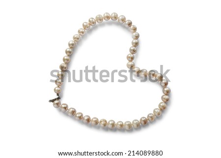 Pearl necklace in the shape of a heart on white background