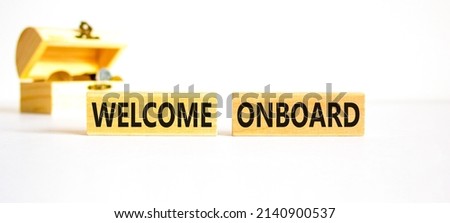Welcome onboard symbol. Concept words Welcome onboard on wooden blocks on a beautiful white table white background. Wooden chest with coins. Business onboarding and welcome onboard concept copy space.