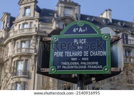 parisian street name plate sign on building facade