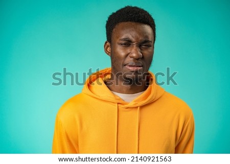 Young black anxious man worried nervous fail problem over mint background