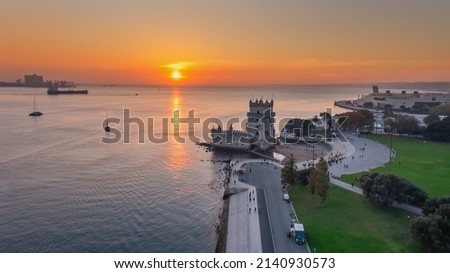Aerial view of the Portuguese Historical Folk Patrimony, Belem Tower, on the Tagus River. During sunset. Royalty-Free Stock Photo #2140930573