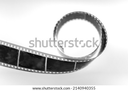 35mm Monochrome camera film strip on white background.