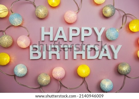 Happy Birthday alphabet letters on pink background