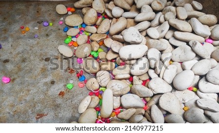 white stones and colorful stones as background