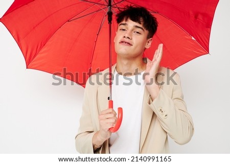 A young man rain protection in hand in hand modern style isolated background unaltered