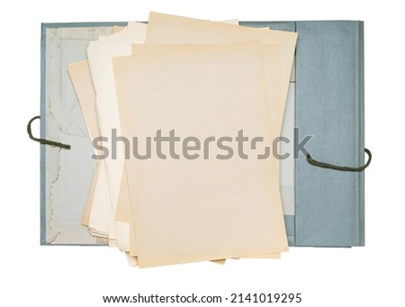 Folder with old yellowed paper sheets on a white background.