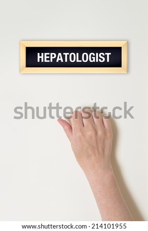 Female hand is knocking on Hepatologist door for a medical exam Royalty-Free Stock Photo #214101955