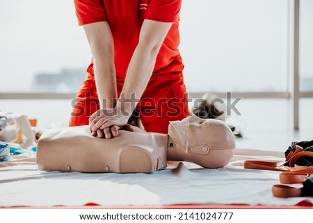Training on emergency medical care was conducted by a Red Cross instructor in the office space for the civilian population of Ukraine due to the military attack on Russia Royalty-Free Stock Photo #2141024777