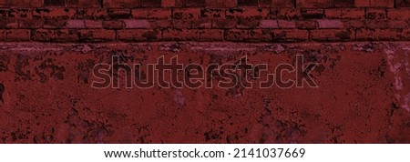Old building basement with cracked plaster and peeling paint panorama. Dark red brick concrete wall wide banner texture. Grunge gloomy sinister panoramic background