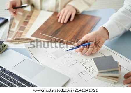 Asian architect designing a house Royalty-Free Stock Photo #2141041921