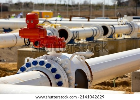 Construction site of an interconnected natural gas transmission pipeline. Highly integrated network that moves natural gas. Connection point between the transmission company and the receiving party. Royalty-Free Stock Photo #2141042629