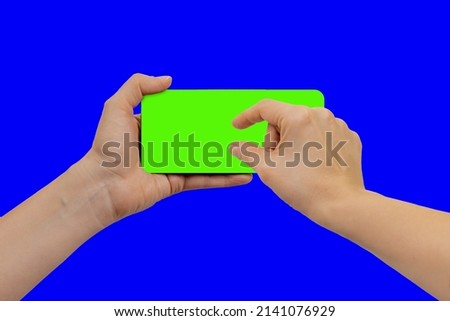 Young woman changing mobile phone display size, the device is located frontally flat lay