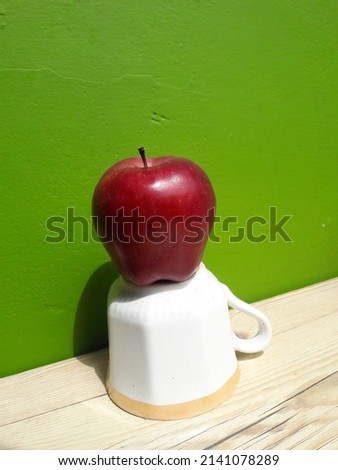 The red apple is placed on the table