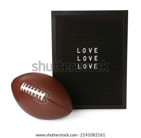 American football ball and letter board with words Love on white background
