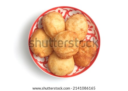 National Kazakh pastries baursaks in a plate on a white background Royalty-Free Stock Photo #2141086165