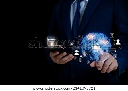 man holding the illustration of the world in hand media technology, ready icon business concept, future technology business goals Online communication, Wi-Fi to connect to communicate information. Royalty-Free Stock Photo #2141095721