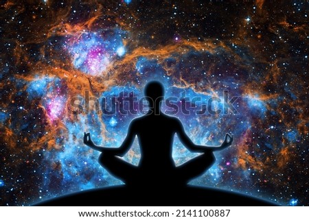 Yoga figure against  universe background with Nebula.- Elements of this image furnished by NASA
