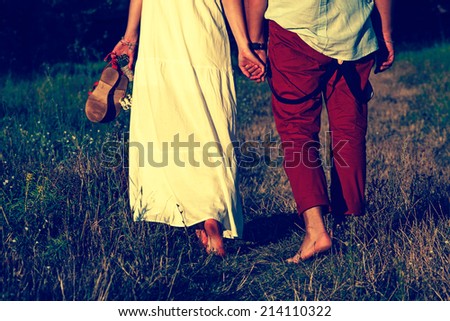 couple walking in summer landscape