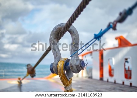 Towing wire on Anchor-handling Tug Supply vessel during towing.  Royalty-Free Stock Photo #2141108923