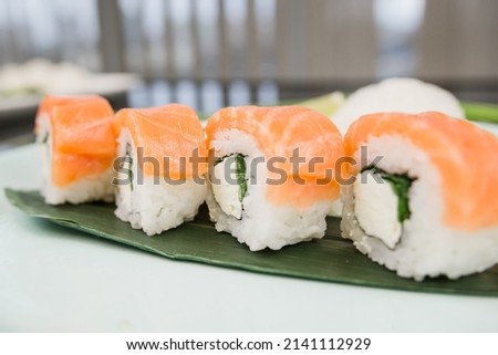 a sushi roll philadelphia with salmon on a plate japanese cuisine
