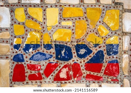 National flag of Colombia on stone  wall background. Flag  banner on  stone texture background.