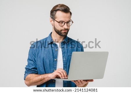 Successful caucasian young freelancer student using laptop for online remote work, watching webinars, e-learning, e-banking isolated in white background