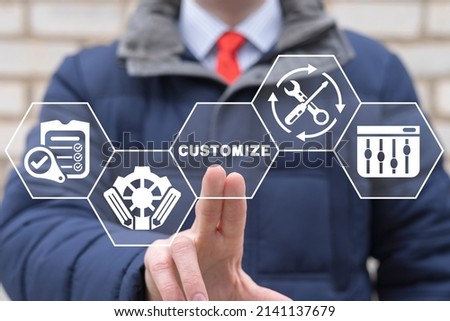 Concept of customization business product. Businessman using virtual touchscreen presses word of customize. Royalty-Free Stock Photo #2141137679