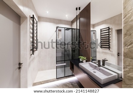 the interior of the bathroom in the house with a mirror shower