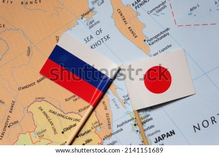 japan and russia flags placed on a map of east Asia.Selective focus on flag.
 Local conflicts. Territorial disputes.Border crisis. Tensions. Danger of war.Four Northern Islands Disputes.Kuril Islands. Royalty-Free Stock Photo #2141151689