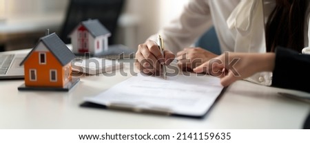 Real estate agent offer hand for customer sign agreement contract signature for buy or sell house. Real estate concept contact agreement concept