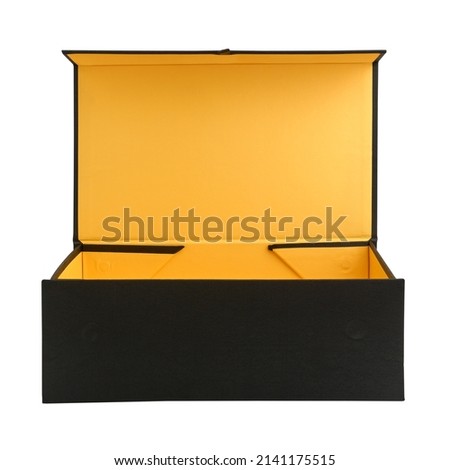 Large open cardboard packing box, covered with black cloth, close-up, isolated on white background Royalty-Free Stock Photo #2141175515