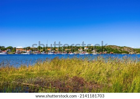 Picturesque coastal landscape of maritime structures and the sound between the islands of South and North Koster, Bohuslän, Västra Götalands län, Sweden. Royalty-Free Stock Photo #2141181703