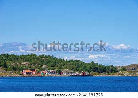 Picturesque coastal landscape with marina, South coast of North Koster Island, Bohuslän, Västra Götalands län, Sweden. Royalty-Free Stock Photo #2141181725