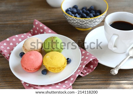 colorful macaroon on a plate with berries