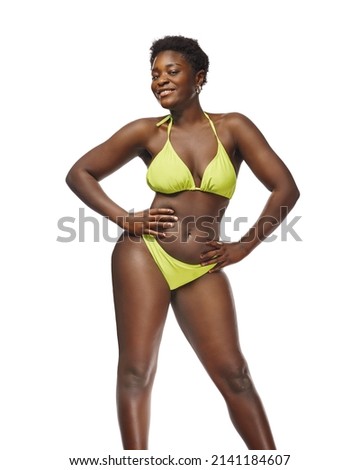  African American woman in bikini confident with her body 