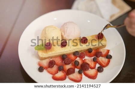 cake and ice cream with fork hand for eat