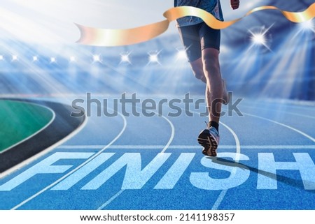 Runners running towards the finish line. Success concept. Royalty-Free Stock Photo #2141198357